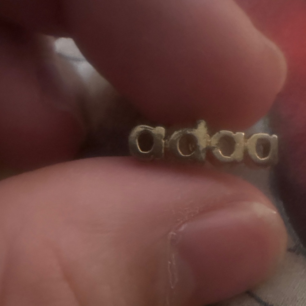 Gold Tone Single Earring or Pin with “adaa” lettering